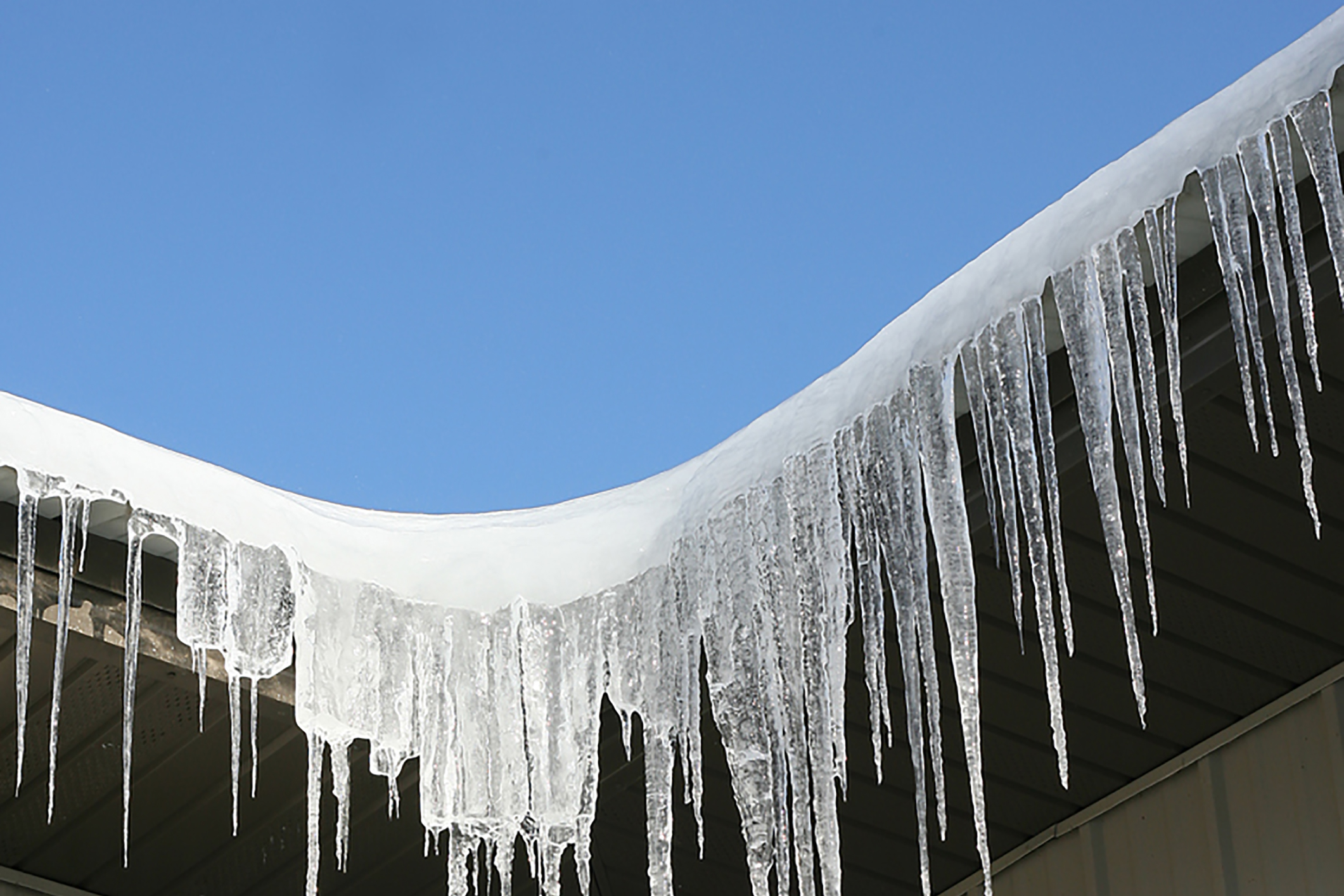 Icicles on the corner of a commercial building in winter